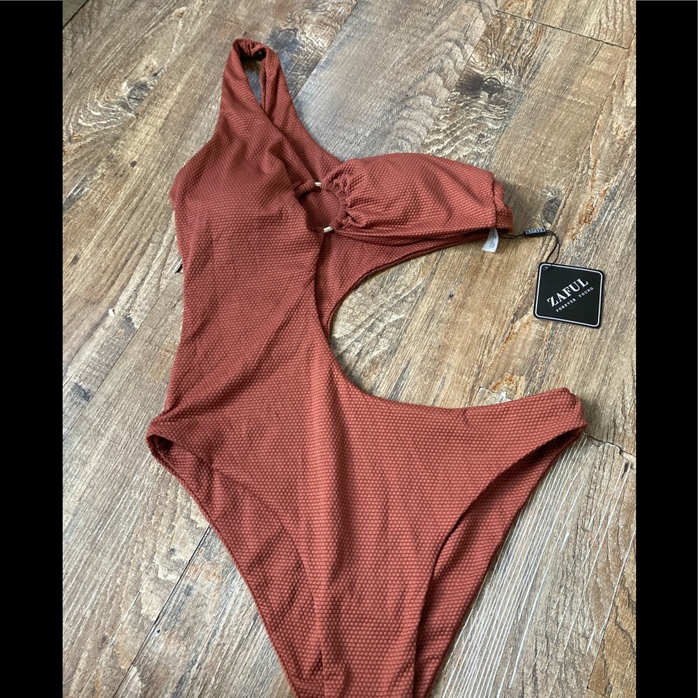 Size medium Zaful one piece in rust color